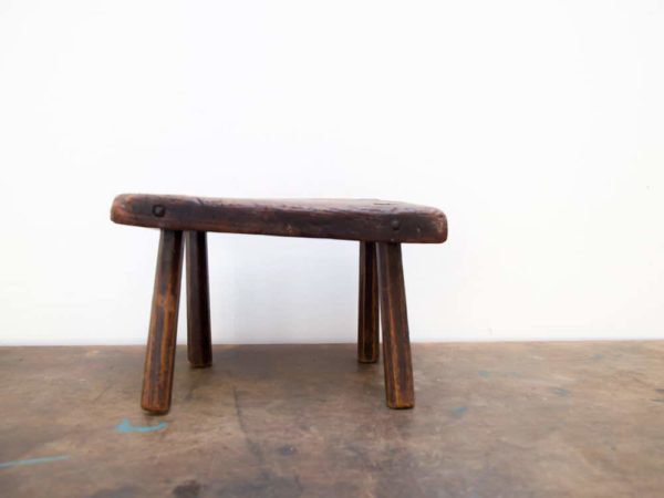 antique milking stool