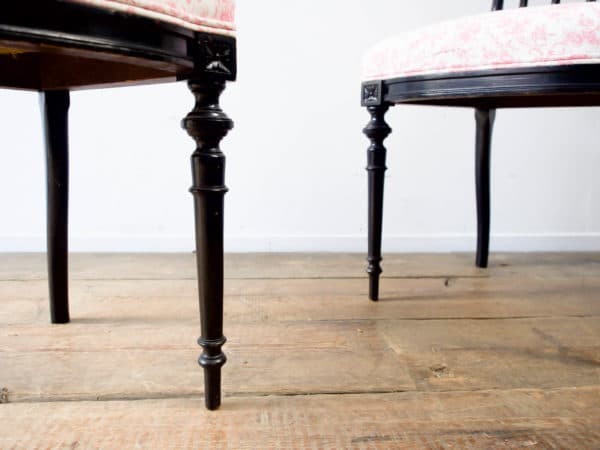 A pair of Asethetic movement, ebonised chairs