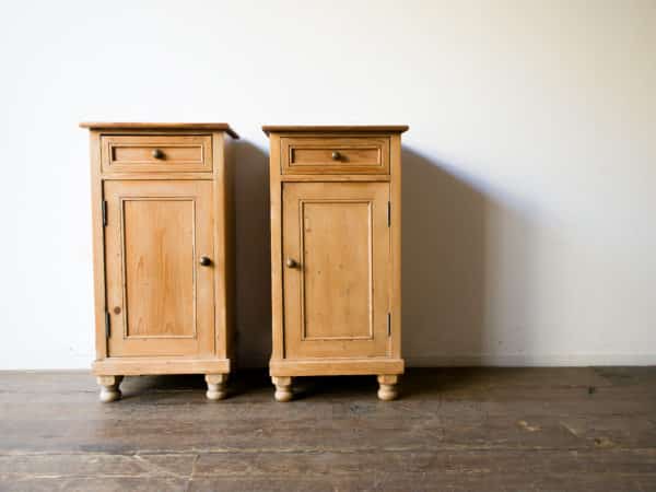 A pair of antique pine bedsides